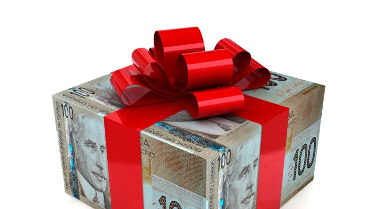 Gift box with currency-detail wrapping paper and ribbon